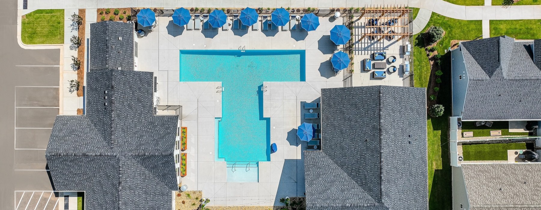 a drop down view of a swimming pool in a courtyard