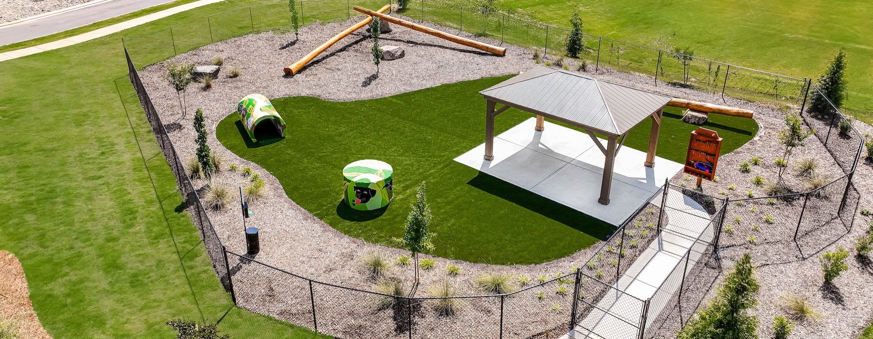 an aerial view of a dog park