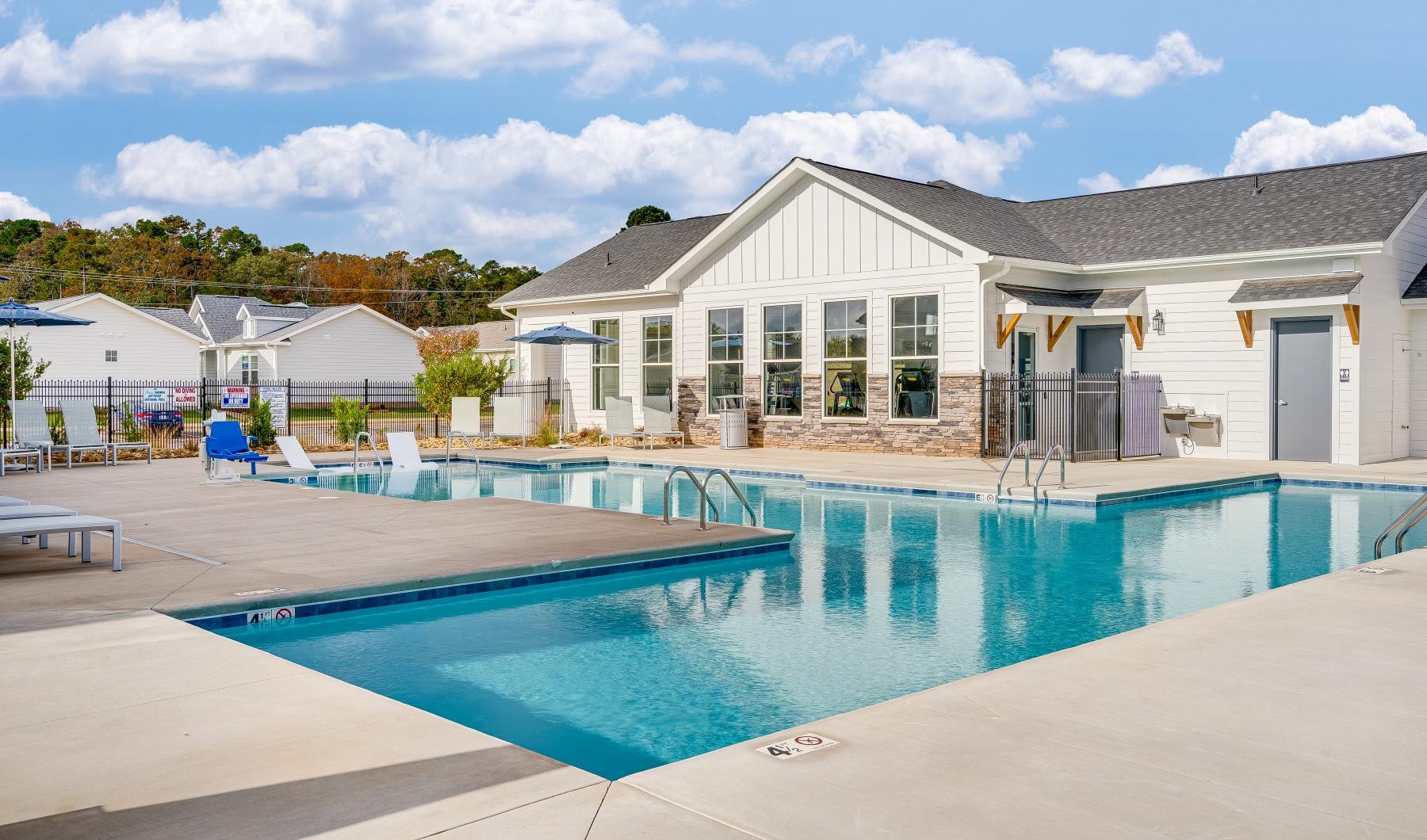 a swimming pool in front of a building