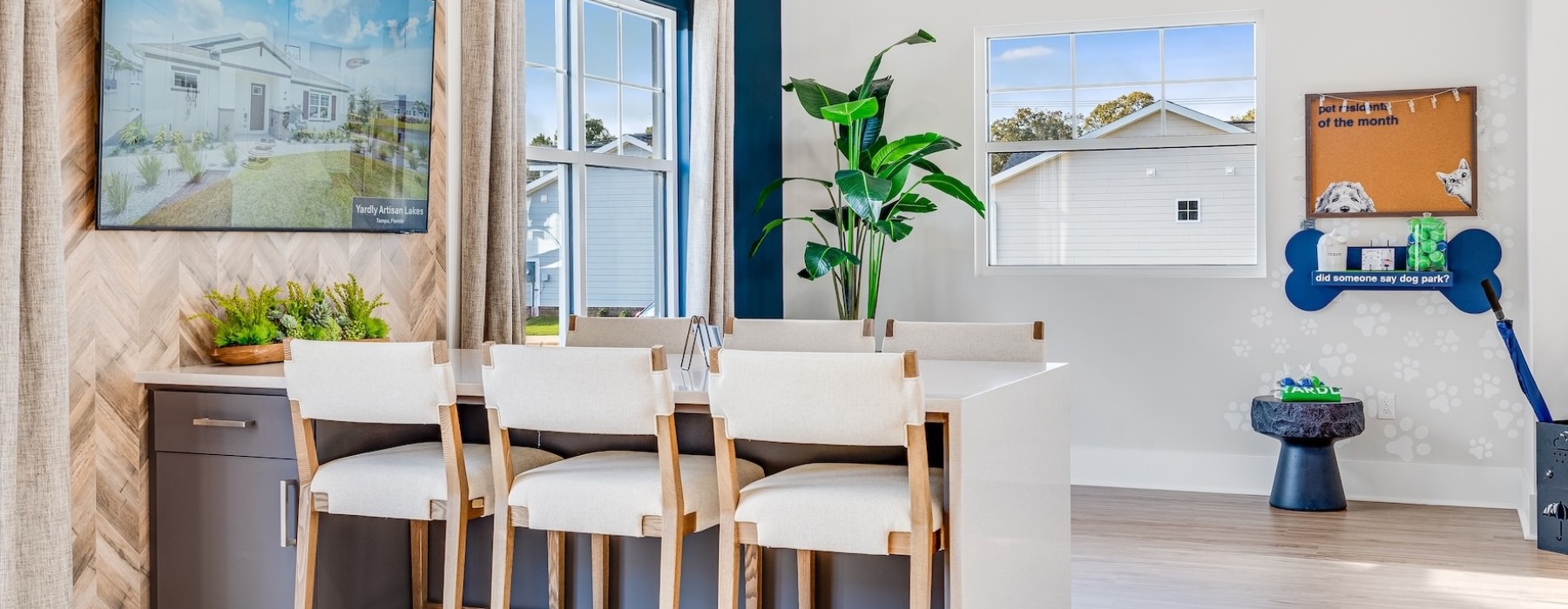 a lounge area with a table and chairs