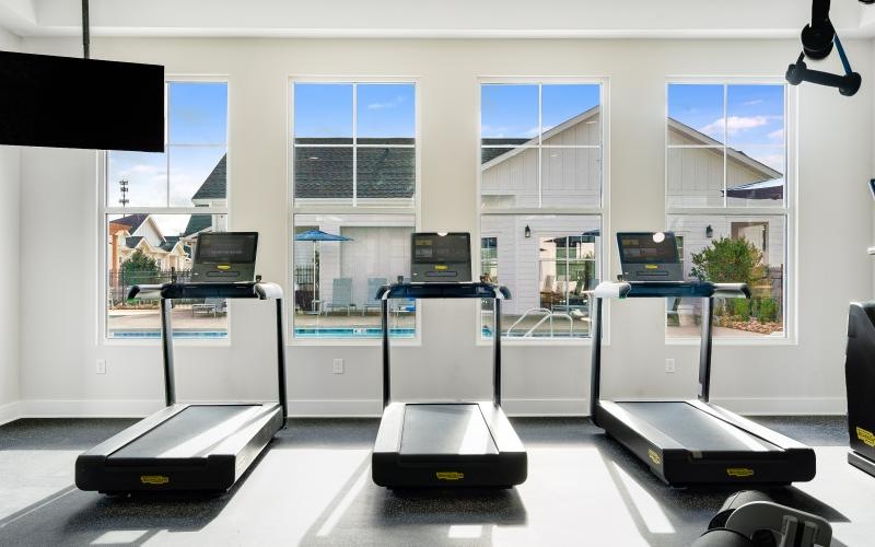 a room with treadmills and a tv