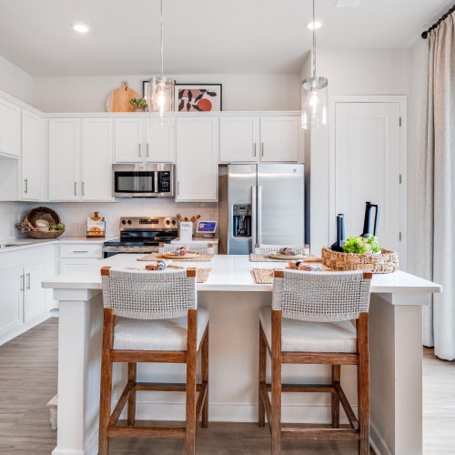 a kitchen with white cabinets