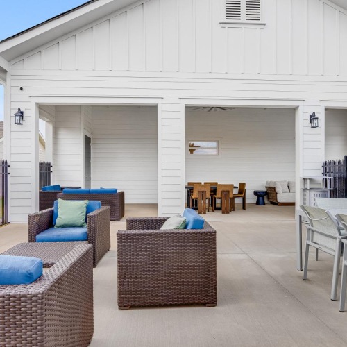 a patio with chairs and tables